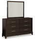 Neymorton California King Upholstered Panel Bed with Mirrored Dresser and Chest